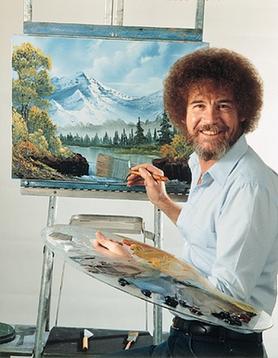 Bob Ross smiling with paintbrush and palette